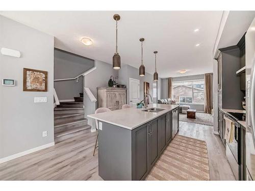 148 Dawson Drive, Chestermere, AB - Indoor Photo Showing Kitchen With Double Sink With Upgraded Kitchen