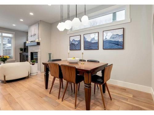 1937 47 Avenue Sw, Calgary, AB - Indoor Photo Showing Dining Room With Fireplace