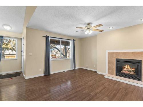 412 Templeside Circle Ne, Calgary, AB - Indoor Photo Showing Other Room With Fireplace