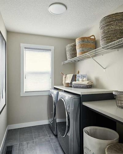 83 Cranbrook Mount Se, Calgary, AB - Indoor Photo Showing Laundry Room