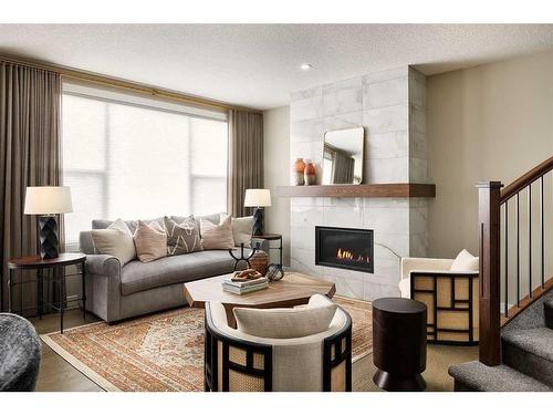 83 Cranbrook Mount Se, Calgary, AB - Indoor Photo Showing Living Room With Fireplace