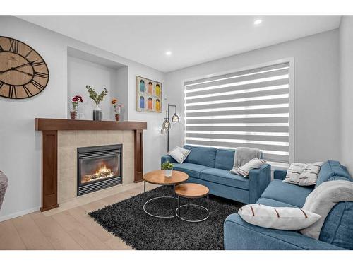 260 Copperstone Gardens Se, Calgary, AB - Indoor Photo Showing Living Room With Fireplace