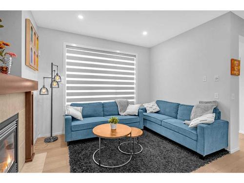 260 Copperstone Gardens Se, Calgary, AB - Indoor Photo Showing Living Room With Fireplace