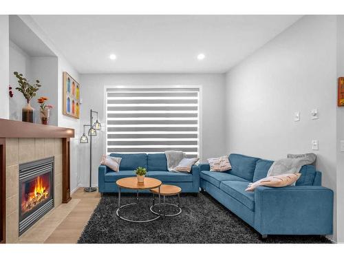 260 Copperstone Gardens Se, Calgary, AB - Indoor Photo Showing Living Room With Fireplace