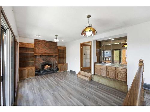 251 Maunsell Close Ne, Calgary, AB - Indoor Photo Showing Living Room With Fireplace