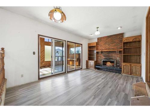 251 Maunsell Close Ne, Calgary, AB - Indoor Photo Showing Living Room With Fireplace