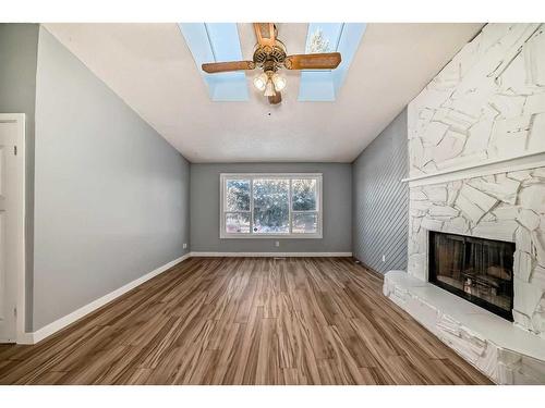 79 Castleglen Way Ne, Calgary, AB - Indoor Photo Showing Living Room With Fireplace