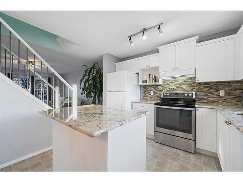 97 Covepark Close Ne, Calgary, AB - Indoor Photo Showing Kitchen With Upgraded Kitchen