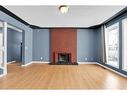 50 Pinelore Place Ne, Calgary, AB  - Indoor Photo Showing Living Room With Fireplace 