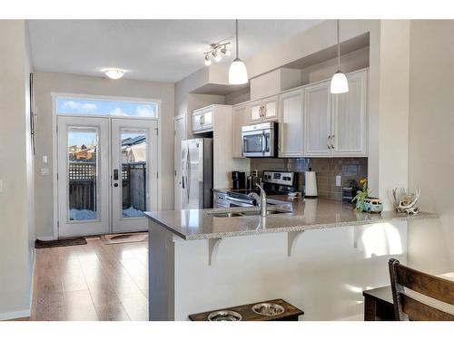 100 Legacy Main Street Se, Calgary, AB - Indoor Photo Showing Kitchen With Double Sink With Upgraded Kitchen