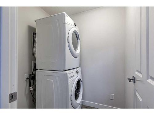 49 Evanscrest Court Nw, Calgary, AB - Indoor Photo Showing Laundry Room