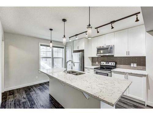 49 Evanscrest Court Nw, Calgary, AB - Indoor Photo Showing Kitchen With Stainless Steel Kitchen With Double Sink With Upgraded Kitchen