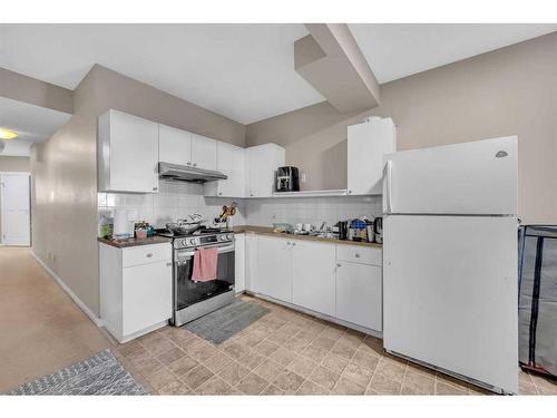 250 Martinwood Place Ne, Calgary, AB - Indoor Photo Showing Kitchen With Double Sink