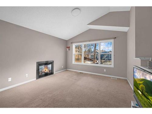 250 Martinwood Place Ne, Calgary, AB - Indoor Photo Showing Living Room With Fireplace