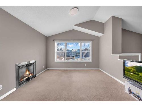 250 Martinwood Place Ne, Calgary, AB - Indoor With Fireplace