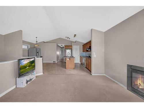 250 Martinwood Place Ne, Calgary, AB - Indoor With Fireplace