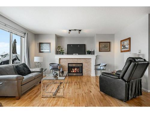 9 Royal Birch Close Nw, Calgary, AB - Indoor Photo Showing Living Room With Fireplace