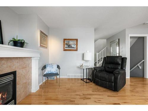 9 Royal Birch Close Nw, Calgary, AB - Indoor Photo Showing Living Room With Fireplace