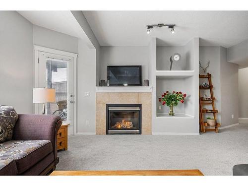 9 Royal Birch Close Nw, Calgary, AB - Indoor Photo Showing Living Room With Fireplace