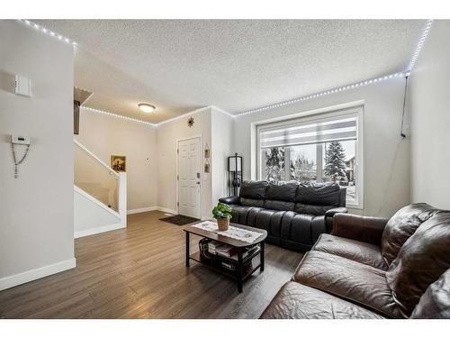 54 Shawbrooke Court Sw, Calgary, AB - Indoor Photo Showing Living Room