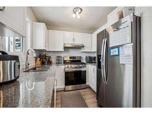 54 Shawbrooke Court Sw, Calgary, AB - Indoor Photo Showing Kitchen With Stainless Steel Kitchen With Double Sink