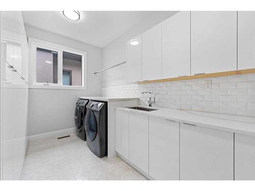 102 Malibou Road Sw, Calgary, AB - Indoor Photo Showing Laundry Room