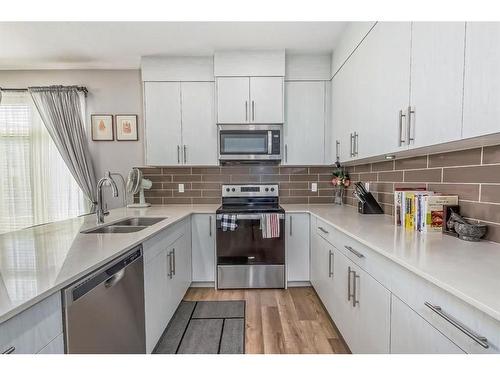 504 Sage Meadows Gardens Nw, Calgary, AB - Indoor Photo Showing Kitchen With Double Sink With Upgraded Kitchen