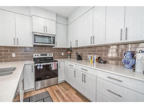 504 Sage Meadows Gardens Nw, Calgary, AB - Indoor Photo Showing Kitchen With Upgraded Kitchen