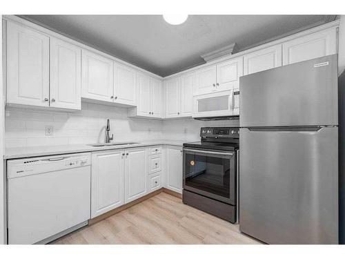 212-5000 Somervale Court Sw, Calgary, AB - Indoor Photo Showing Kitchen