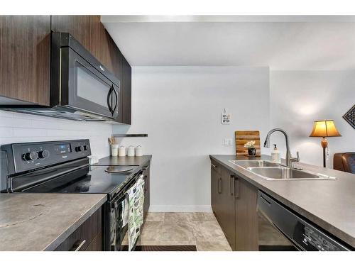 174-300 Marina Drive, Chestermere, AB - Indoor Photo Showing Kitchen With Double Sink