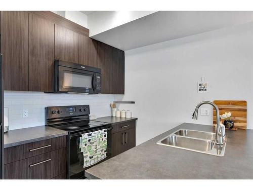 174-300 Marina Drive, Chestermere, AB - Indoor Photo Showing Kitchen With Double Sink