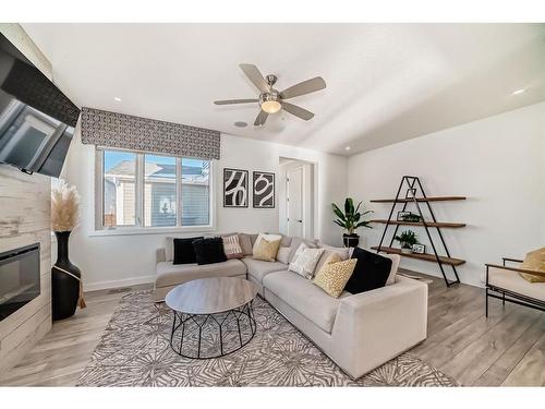 203 Carrington Circle Nw, Calgary, AB - Indoor Photo Showing Living Room With Fireplace