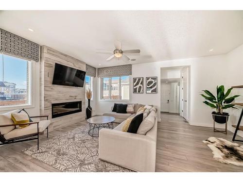 203 Carrington Circle Nw, Calgary, AB - Indoor Photo Showing Living Room With Fireplace