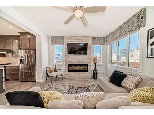 203 Carrington Circle Nw, Calgary, AB - Indoor Photo Showing Living Room With Fireplace