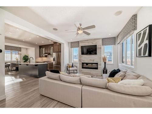 203 Carrington Circle Nw, Calgary, AB - Indoor Photo Showing Living Room With Fireplace