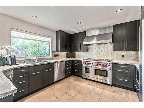 133 Candle Place Sw, Calgary, AB - Indoor Photo Showing Kitchen With Double Sink With Upgraded Kitchen