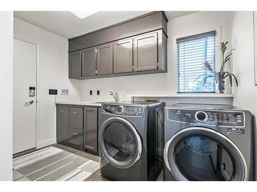 133 Candle Place Sw, Calgary, AB - Indoor Photo Showing Laundry Room