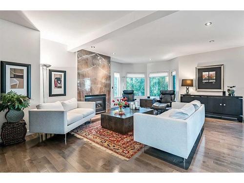 133 Candle Place Sw, Calgary, AB - Indoor Photo Showing Living Room With Fireplace