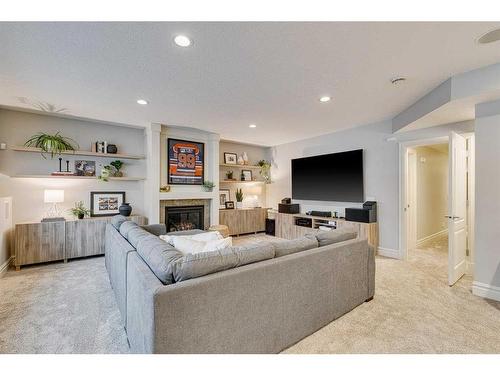 432 Discovery Ridge Bay Sw, Calgary, AB - Indoor Photo Showing Living Room With Fireplace