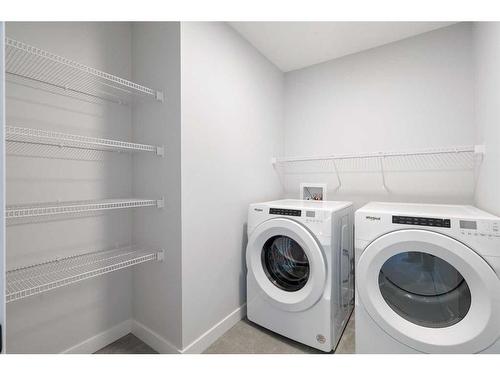 200 Precedence Hill, Cochrane, AB - Indoor Photo Showing Laundry Room