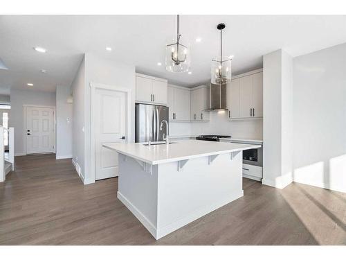 200 Precedence Hill, Cochrane, AB - Indoor Photo Showing Kitchen With Upgraded Kitchen