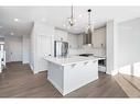 200 Precedence Hill, Cochrane, AB  - Indoor Photo Showing Kitchen With Upgraded Kitchen 