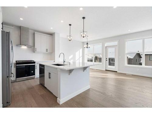 200 Precedence Hill, Cochrane, AB - Indoor Photo Showing Kitchen With Upgraded Kitchen