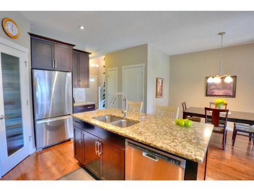 18 Nolanfield Lane Nw, Calgary, AB - Indoor Photo Showing Kitchen With Stainless Steel Kitchen With Double Sink