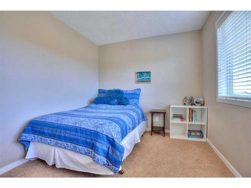 18 Nolanfield Lane Nw, Calgary, AB - Indoor Photo Showing Bedroom