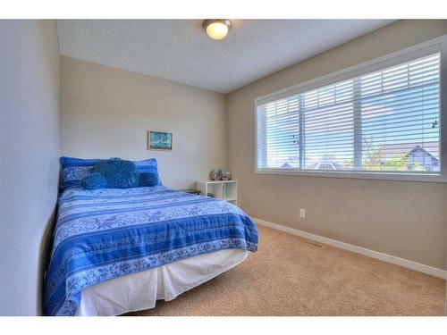 18 Nolanfield Lane Nw, Calgary, AB - Indoor Photo Showing Bedroom