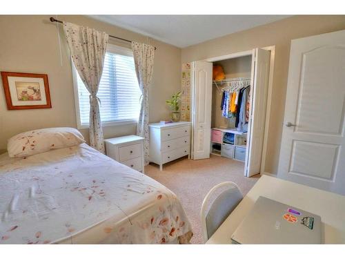 18 Nolanfield Lane Nw, Calgary, AB - Indoor Photo Showing Bedroom