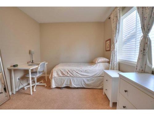 18 Nolanfield Lane Nw, Calgary, AB - Indoor Photo Showing Bedroom