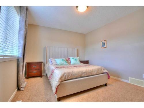 18 Nolanfield Lane Nw, Calgary, AB - Indoor Photo Showing Bedroom