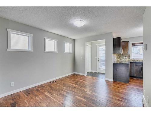 167 Silverado Plains Circle Sw, Calgary, AB - Indoor Photo Showing Other Room With Fireplace